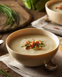 Potato and Leek Soup topped with bacon and chives